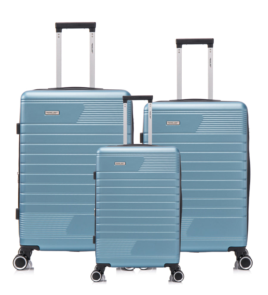 Valise bleu robuste avec roulettes pivotantes, proposée en set de 3 pour les familles et les voyageurs fréquents.